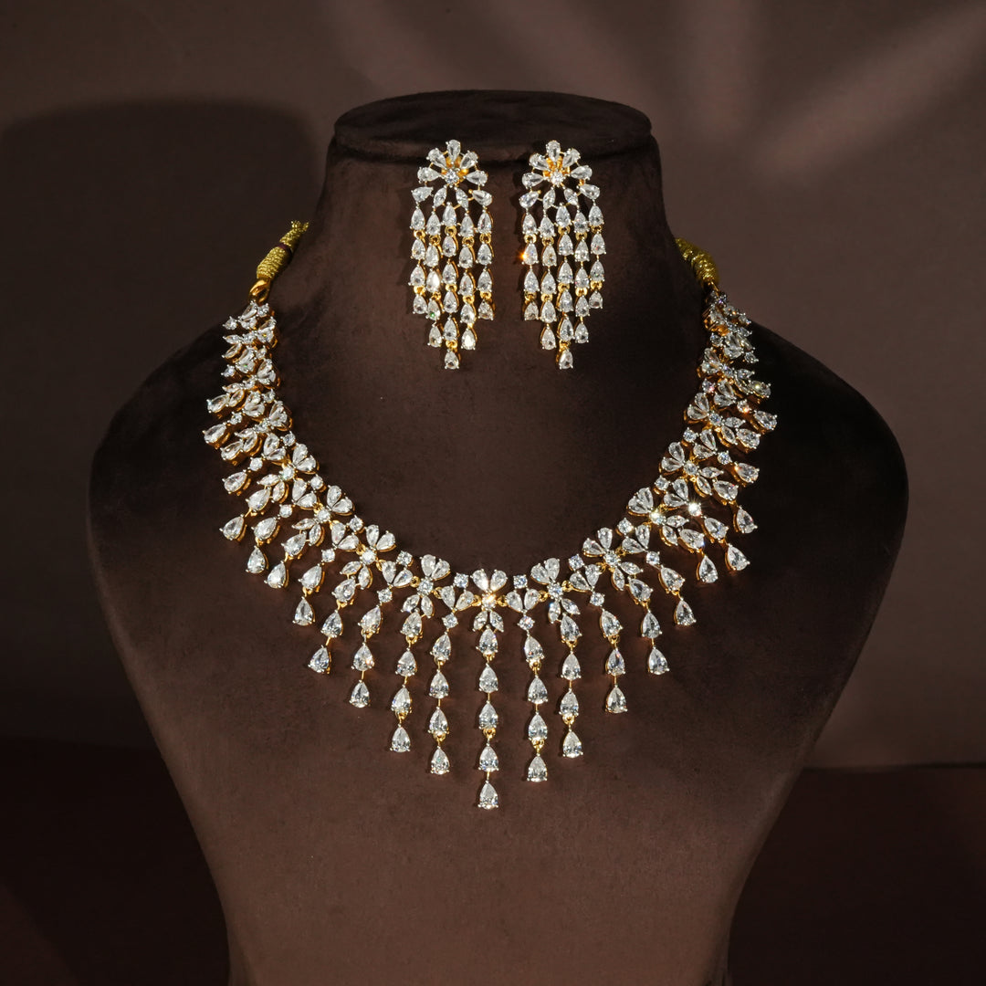 Luxury diamond-look silver necklace with premium cz stones in 92.5 silver, bridal wedding jewellery with gold finish by Sri Fine Jewellery Punjagutta Hyderabad.