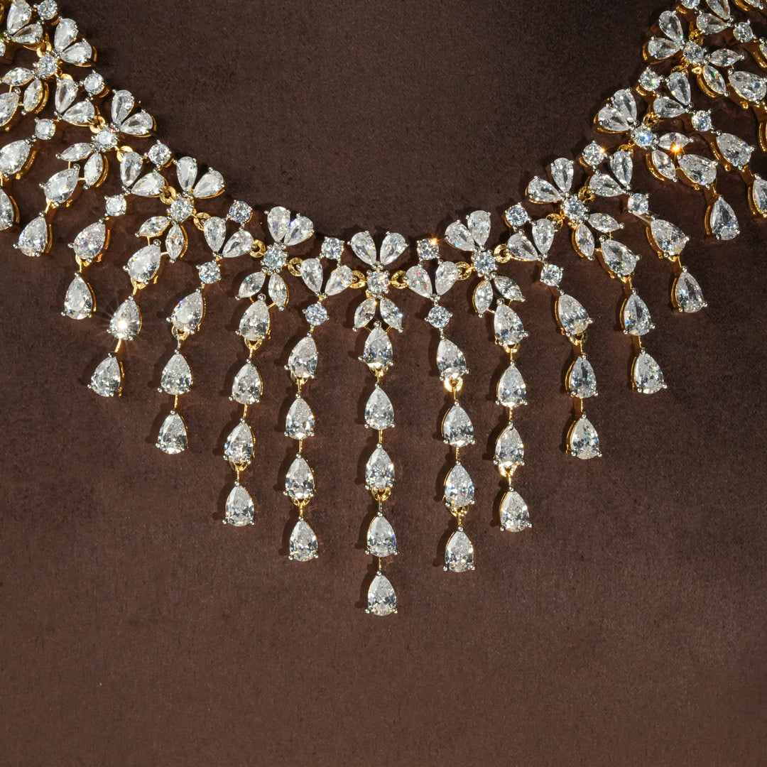 Close-up view of luxury diamond-look silver necklace with premium cz stones in 92.5 silver, bridal wedding jewellery with gold finish by Sri Fine Jewellery Punjagutta Hyderabad.