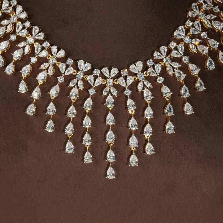 Close-up view of luxury diamond-look silver necklace with premium cz stones in 92.5 silver, bridal wedding jewellery with gold finish by Sri Fine Jewellery Punjagutta Hyderabad.