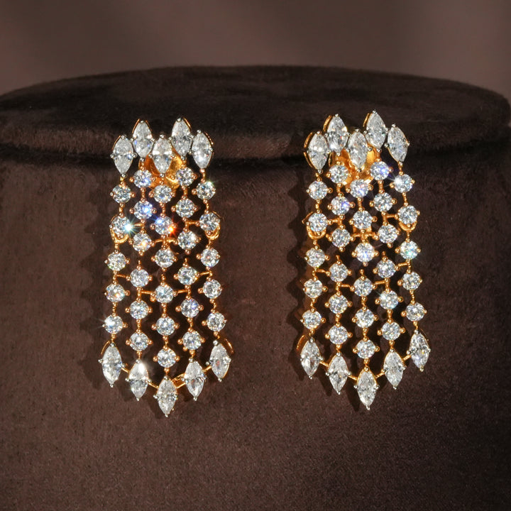 Luxury diamond-look silver earrings with premium cz stones and matching earrings in 92.5 silver, bridal wedding jewellery with gold finish by Sri Fine Jewellery Punjagutta Hyderabad.