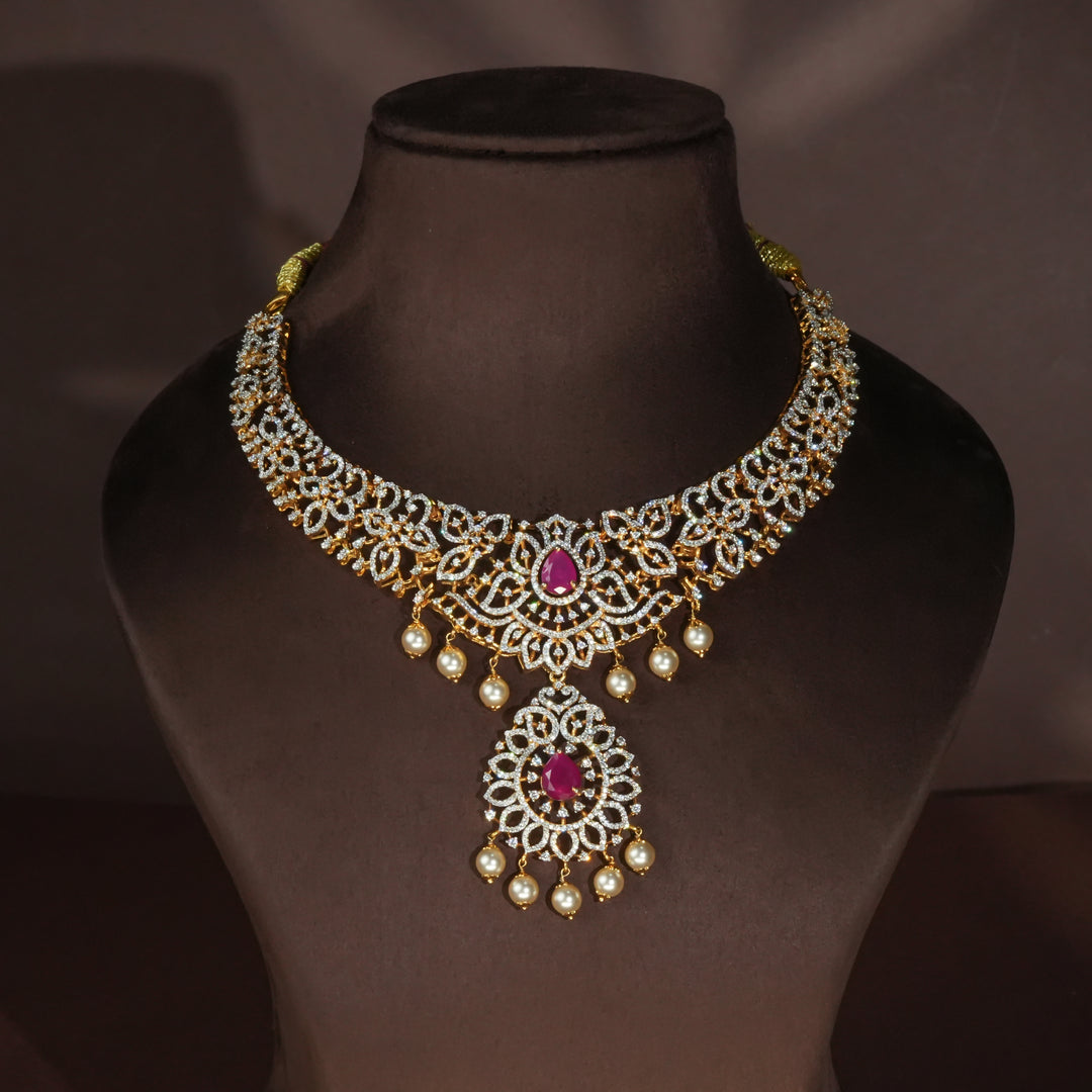 Luxury diamond-look silver necklace with premium cz stones and semi-precious ruby accents in 92.5 silver, bridal wedding jewellery with gold finish by Sri Fine Jewellery Punjagutta Hyderabad.