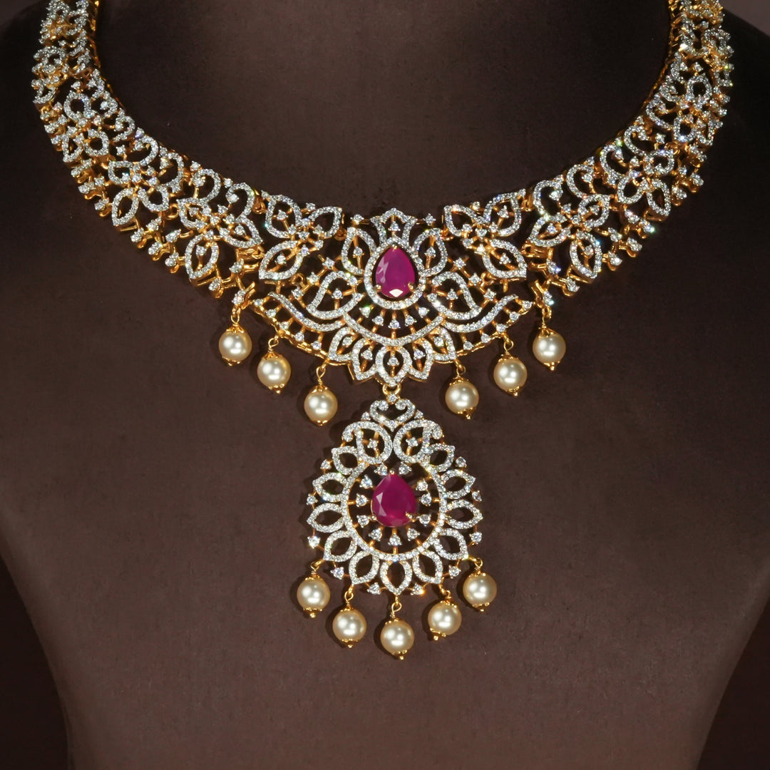 Luxury diamond-look silver necklace with premium cz stones and semi-precious ruby accents in 92.5 silver, bridal wedding jewellery with gold finish by Sri Fine Jewellery Punjagutta Hyderabad.
