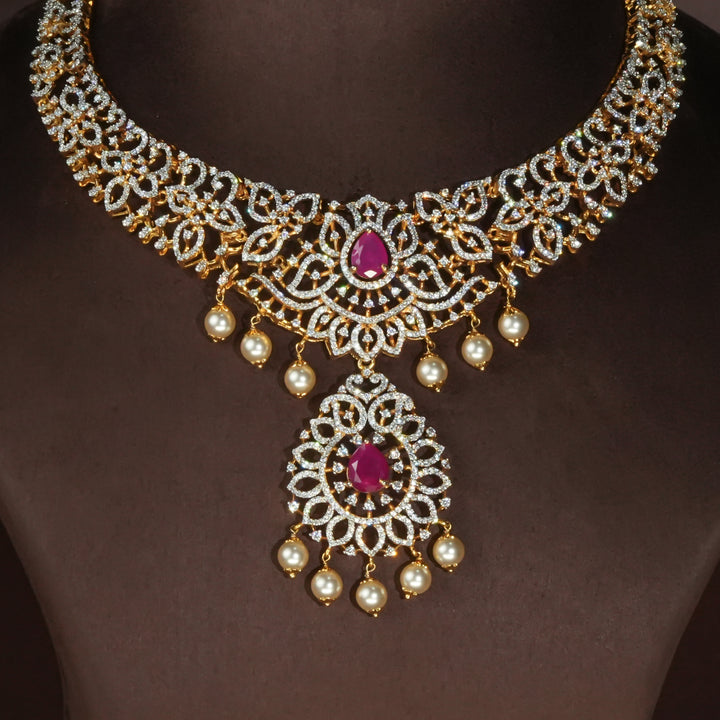 Luxury diamond-look silver necklace with premium cz stones and semi-precious ruby accents in 92.5 silver, bridal wedding jewellery with gold finish by Sri Fine Jewellery Punjagutta Hyderabad.