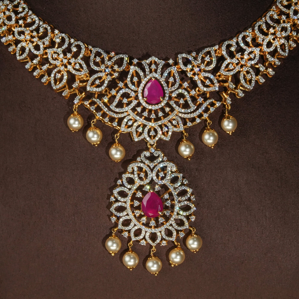 Luxury diamond-look silver necklace with premium cz stones and semi-precious ruby accents in 92.5 silver, bridal wedding jewellery with gold finish by Sri Fine Jewellery Punjagutta Hyderabad.