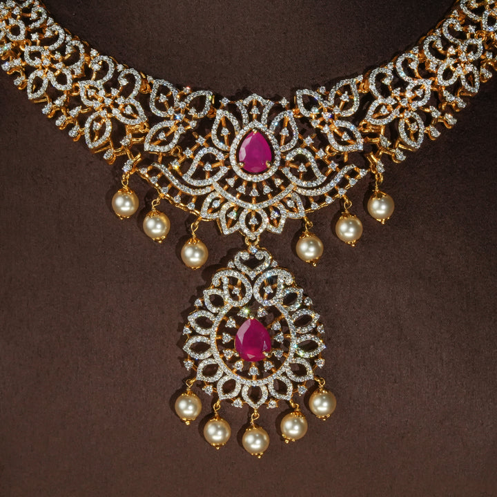 Luxury diamond-look silver necklace with premium cz stones and semi-precious ruby accents in 92.5 silver, bridal wedding jewellery with gold finish by Sri Fine Jewellery Punjagutta Hyderabad.