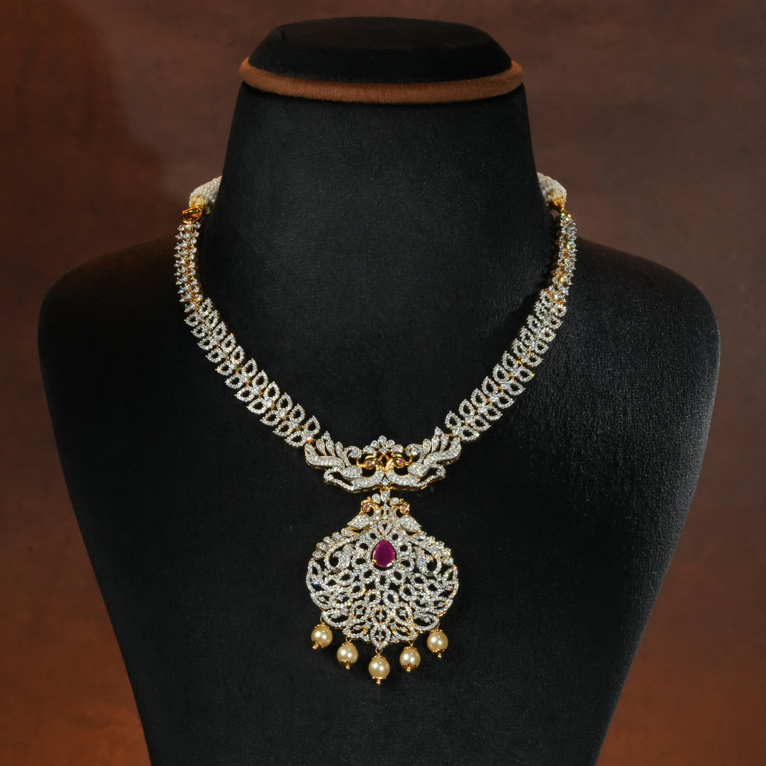 Luxury diamond-look silver necklace with premium cz stones and semi-precious ruby accents in 92.5 silver, bridal wedding jewellery with gold finish by Sri Fine Jewellery Punjagutta Hyderabad.