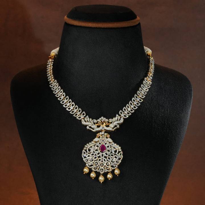 Luxury diamond-look silver necklace with premium cz stones and semi-precious ruby accents in 92.5 silver, bridal wedding jewellery with gold finish by Sri Fine Jewellery Punjagutta Hyderabad.