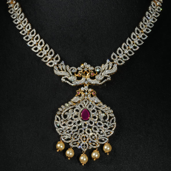 Luxury diamond-look silver necklace with premium cz stones and semi-precious ruby accents in 92.5 silver, bridal wedding jewellery with gold finish by Sri Fine Jewellery Punjagutta Hyderabad.