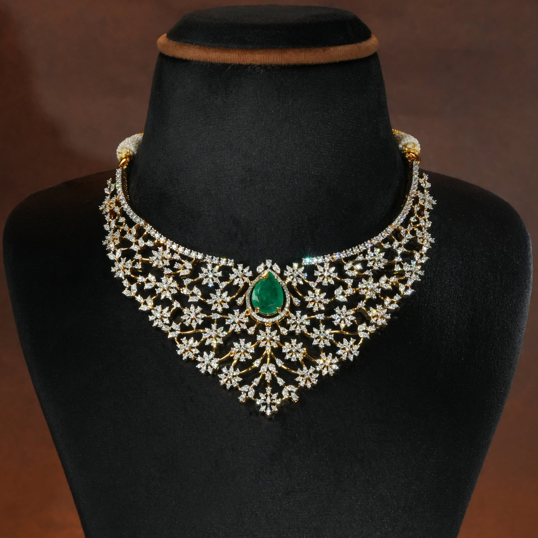 Luxury diamond-look silver necklace with premium cz stones and semi-precious emerald stone in 92.5 silver, bridal wedding jewellery with gold finish by Sri Fine Jewellery Punjagutta Hyderabad.