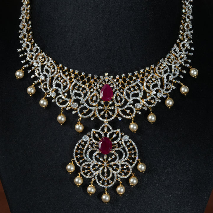 Luxury diamond-look silver necklace with premium cz stones and semi-precious ruby stone in 92.5 silver, bridal wedding jewellery with gold finish by Sri Fine Jewellery Punjagutta Hyderabad.