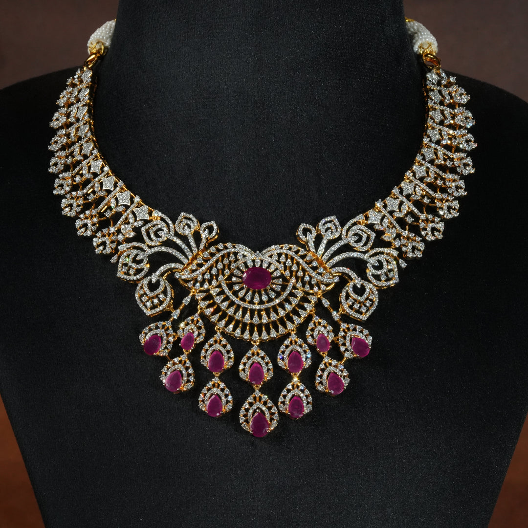 Luxury diamond-look silver necklace  with premium cz stones and semi-precious ruby stones in 92.5 silver, bridal wedding jewellery with gold finish by Sri Fine Jewellery Punjagutta Hyderabad.