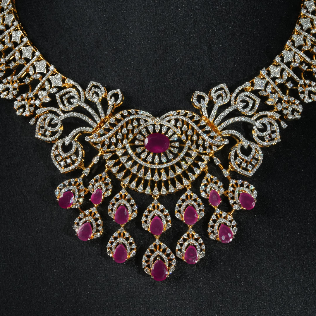 Luxury diamond-look silver necklace 
with premium cz stones and semi-precious ruby stones in 92.5 silver, bridal wedding jewellery with gold finish by Sri Fine Jewellery Punjagutta Hyderabad.