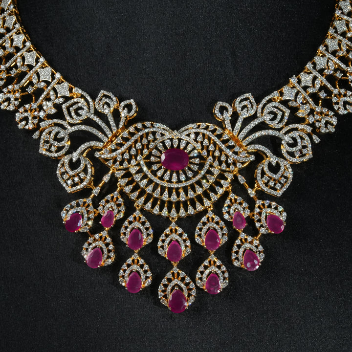 Luxury diamond-look silver necklace 
with premium cz stones and semi-precious ruby stones in 92.5 silver, bridal wedding jewellery with gold finish by Sri Fine Jewellery Punjagutta Hyderabad.