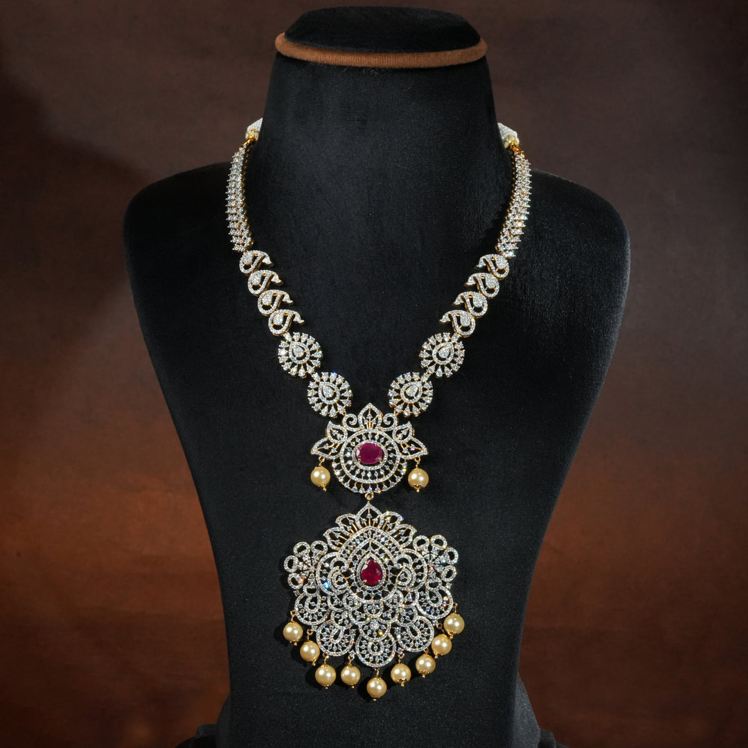 Luxury diamond-look silver necklace with premium cz stones and semi-precious ruby accents in 92.5 silver, bridal wedding jewellery with gold finish by Sri Fine Jewellery Punjagutta Hyderabad.