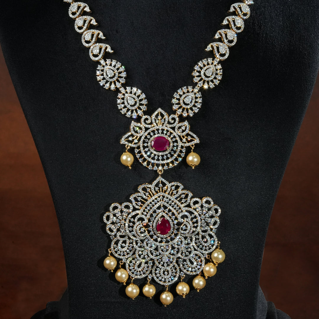 Luxury diamond-look silver necklace with premium cz stones and semi-precious ruby accents in 92.5 silver, bridal wedding jewellery with gold finish by Sri Fine Jewellery Punjagutta Hyderabad.