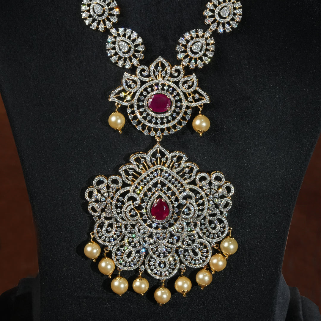 Luxury diamond-look silver necklace with premium cz stones and semi-precious ruby accents in 92.5 silver, bridal wedding jewellery with gold finish by Sri Fine Jewellery Punjagutta Hyderabad.
