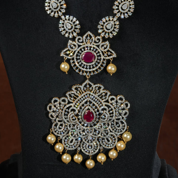 Luxury diamond-look silver necklace with premium cz stones and semi-precious ruby accents in 92.5 silver, bridal wedding jewellery with gold finish by Sri Fine Jewellery Punjagutta Hyderabad.