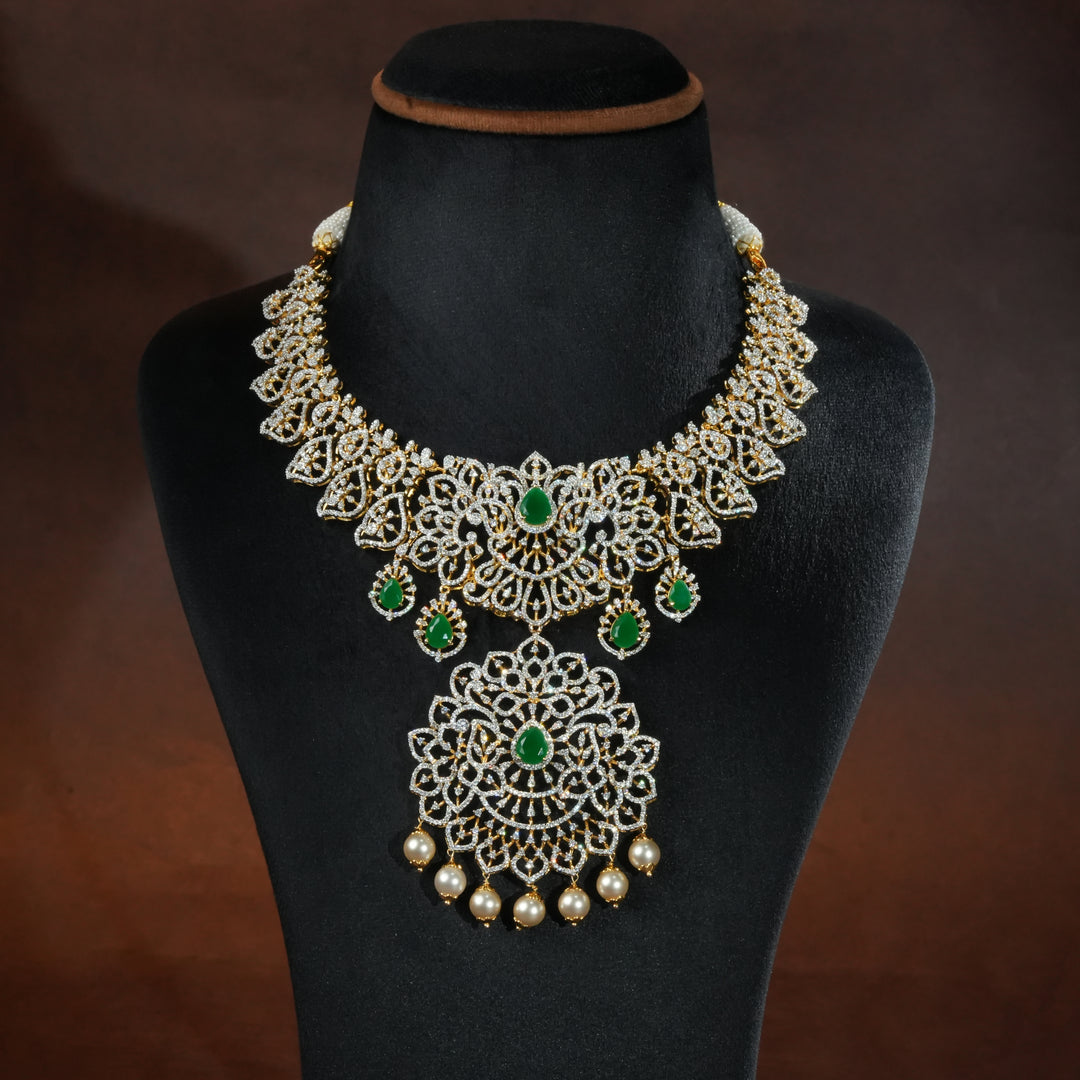 Handcrafted designer 92.5 silver cz emerald necklace with premium cz stones and semi precious emerald embellishments. Perfect for bridal wear, festive occasions, weddings, and traditional ethnic styling.
Sri fine jewellery, Hyderabad. 