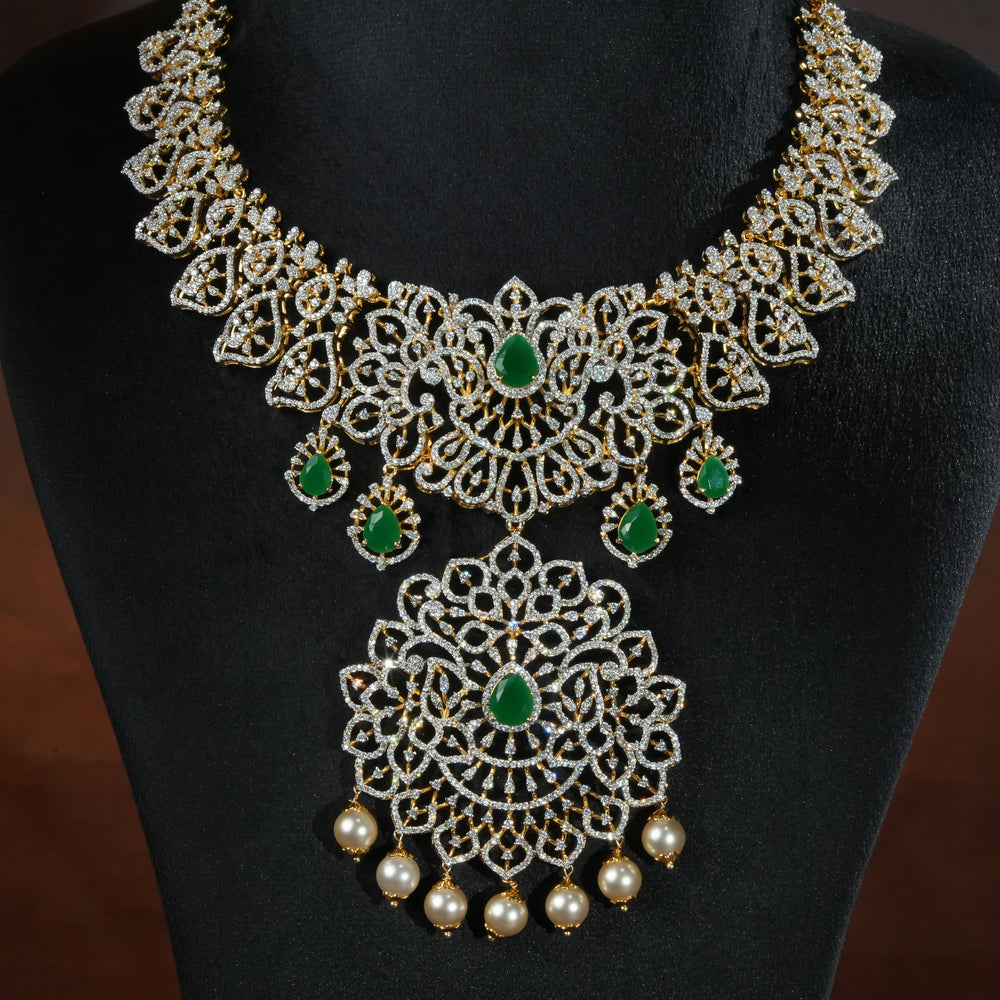 Handcrafted designer 92.5 silver cz emerald necklace with premium cz stones and semi precious emerald embellishments. Perfect for bridal wear, festive occasions, weddings, and traditional ethnic styling.
Sri fine jewellery, Hyderabad. 
