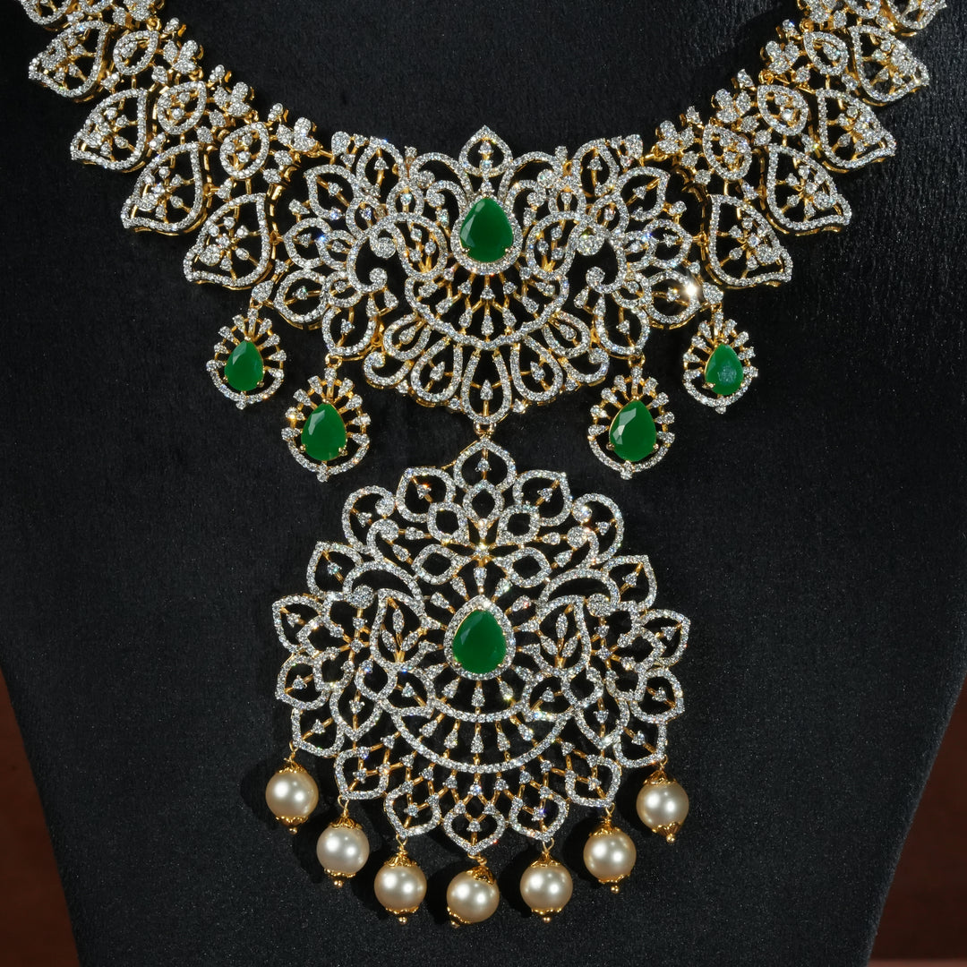 Close-up view of handcrafted designer 92.5 silver cz emerald necklace with premium cz stones and semi precious emerald embellishments. Perfect for bridal wear, festive occasions, weddings, and traditional ethnic styling.
Sri fine jewellery, Hyderabad. 