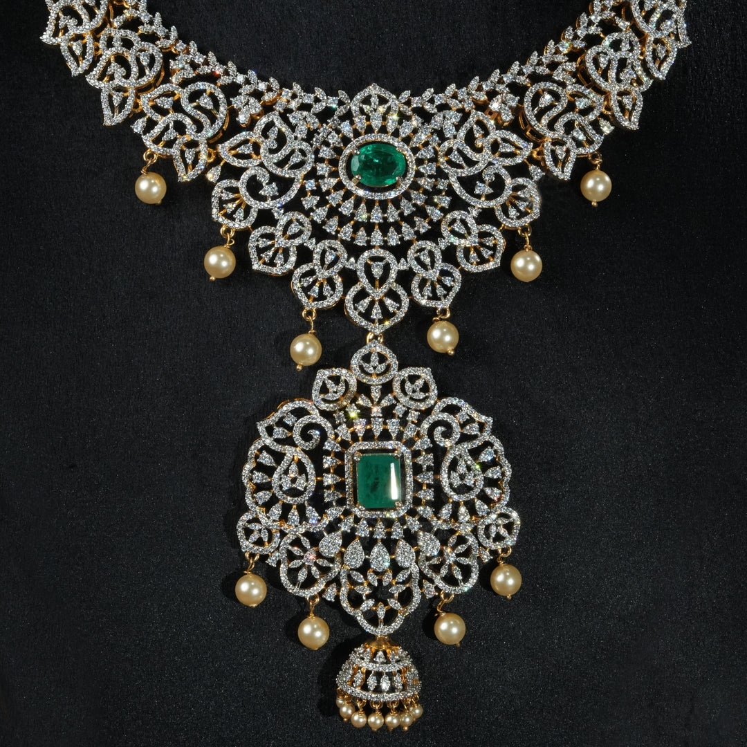 Close-up view of handcrafted designer 92.5 silver cz emerald necklace with premium cz stones, semi precious emerald embellishments and floral motifs . Perfect for bridal wear, festive occasions, weddings, and traditional ethnic styling.
Sri fine jewellery, Hyderabad. 