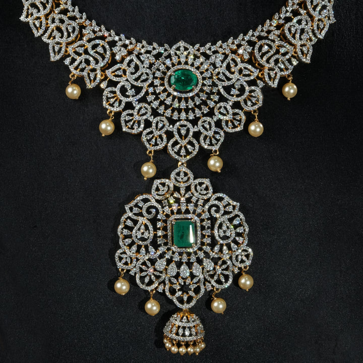 Close-up view of handcrafted designer 92.5 silver cz emerald necklace with premium cz stones, semi precious emerald embellishments and floral motifs . Perfect for bridal wear, festive occasions, weddings, and traditional ethnic styling.
Sri fine jewellery, Hyderabad. 