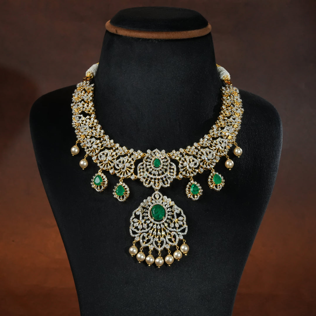 Handcrafted designer 92.5 silver cz emerald necklace with premium cz stones and semi precious emerald embellishments. Perfect for bridal wear, festive occasions, weddings, and traditional ethnic styling.
Sri fine jewellery, Hyderabad. 