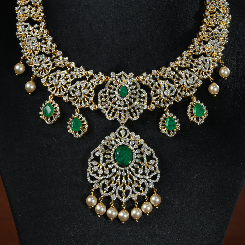 Handcrafted designer 92.5 silver cz emerald necklace with premium cz stones and semi precious emerald embellishments. Perfect for bridal wear, festive occasions, weddings, and traditional ethnic styling.
Sri fine jewellery, Hyderabad. 