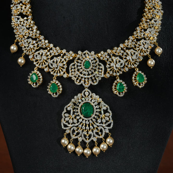 Handcrafted designer 92.5 silver cz emerald necklace with premium cz stones and semi precious emerald embellishments. Perfect for bridal wear, festive occasions, weddings, and traditional ethnic styling.
Sri fine jewellery, Hyderabad. 