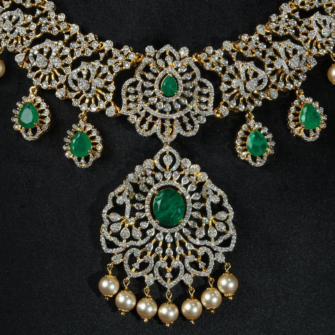 Close-up view of handcrafted designer 92.5 silver cz emerald necklace with premium cz stones and semi precious emerald embellishments. Perfect for bridal wear, festive occasions, weddings, and traditional ethnic styling.
Sri fine jewellery, Hyderabad. 
