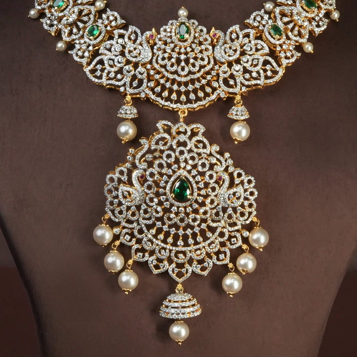 Close-up view of handcrafted designer 92.5 silver cz emerald necklace with premium cz, semi precious emerald embellishments and peacock motifs . Perfect for bridal wear, festive occasions, weddings, and traditional ethnic styling.
Sri fine jewellery, Hyderabad. 
