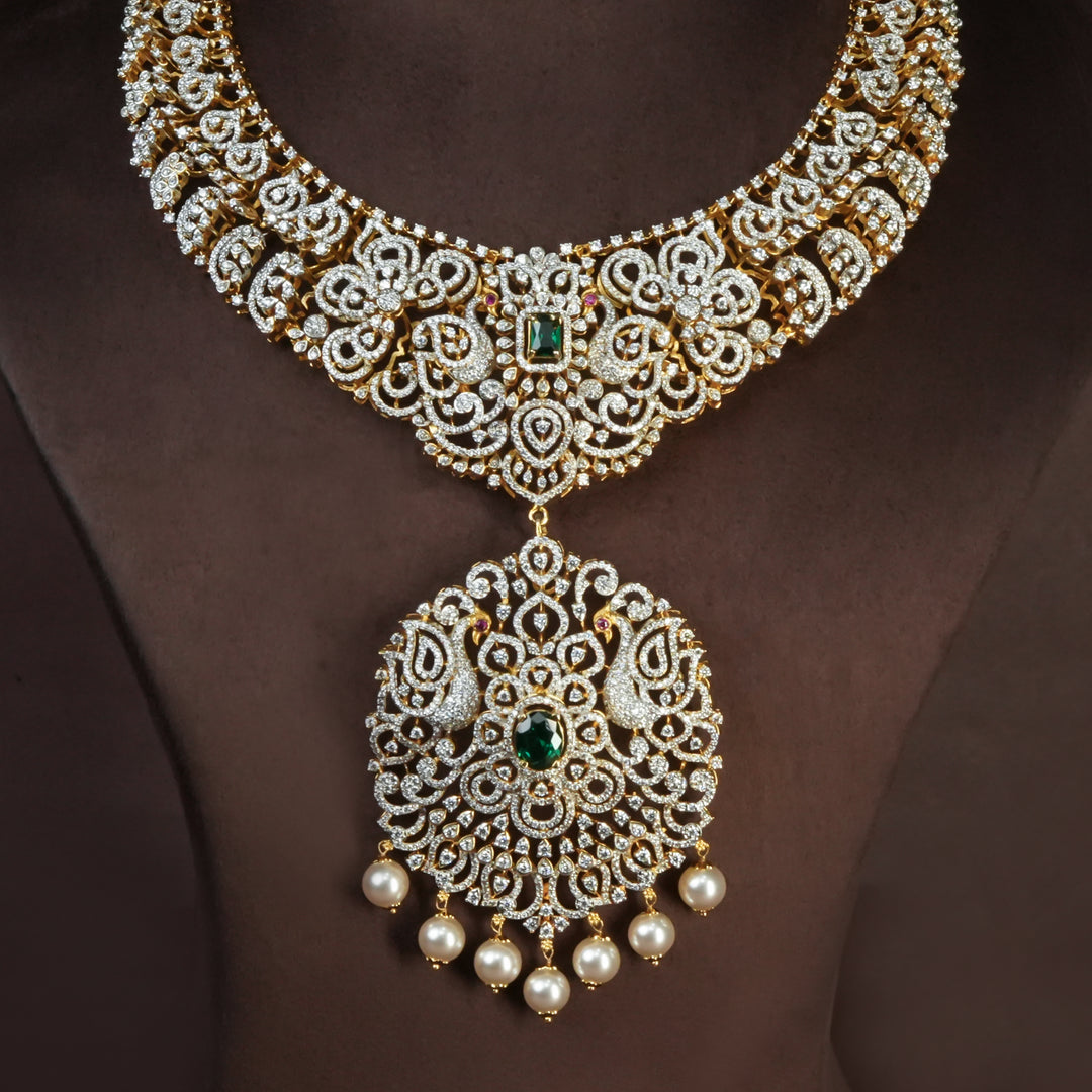 Handcrafted designer 92.5 silver cz emerald necklace with premium cz and semi precious emerald embellishments . Perfect for bridal wear, festive occasions, weddings, and traditional ethnic styling.
Sri fine jewellery, Hyderabad. 