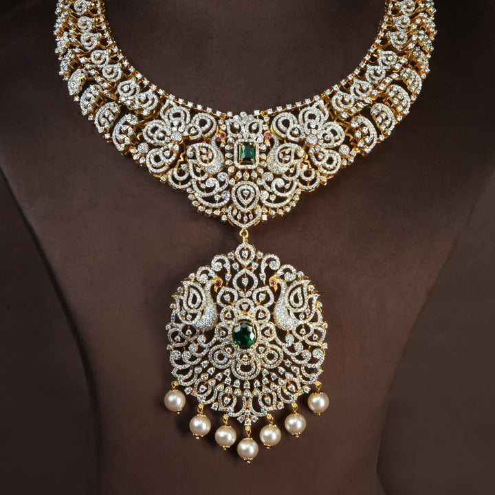 Handcrafted designer 92.5 silver cz emerald necklace with premium cz and semi precious emerald embellishments . Perfect for bridal wear, festive occasions, weddings, and traditional ethnic styling.
Sri fine jewellery, Hyderabad. 