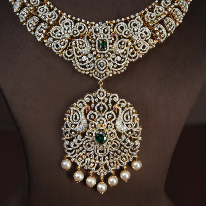 Close-up view of handcrafted designer 92.5 silver cz emerald necklace with premium cz, semi precious emerald embellishments and peacock motifs. Perfect for bridal wear, festive occasions, weddings, and traditional ethnic styling.
Sri fine jewellery, Hyderabad. 