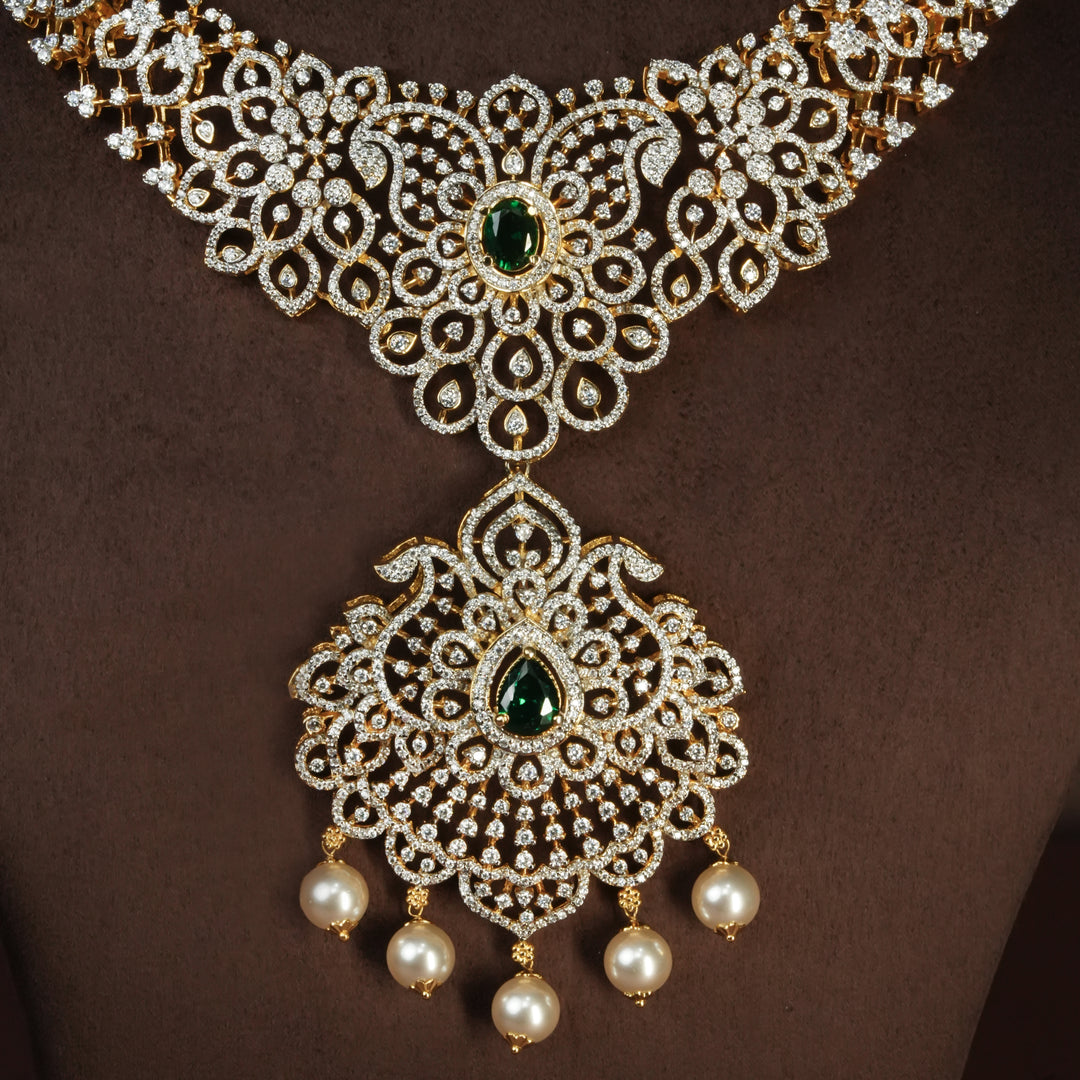 Close-up view of handcrafted designer 92.5 silver cz emerald necklace with premium cz, semi precious emerald embellishments and mango motifs . Perfect for bridal wear, festive occasions, weddings, and traditional ethnic styling.
Sri fine jewellery, Hyderabad. 