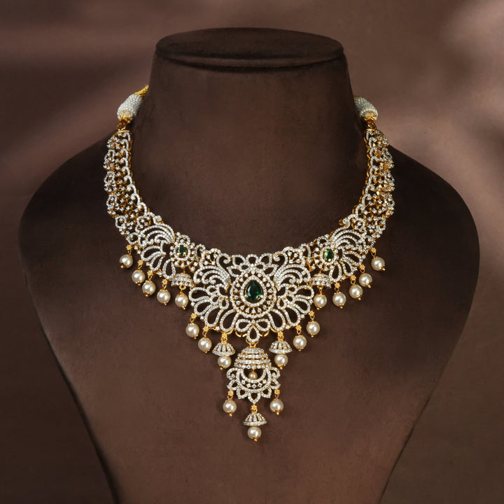 Handcrafted designer 92.5 silver cz emerald necklace with premium cz and semi precious emerald embellishments. Perfect for bridal wear, festive occasions, weddings, and traditional ethnic styling.
Sri fine jewellery, Hyderabad. 
