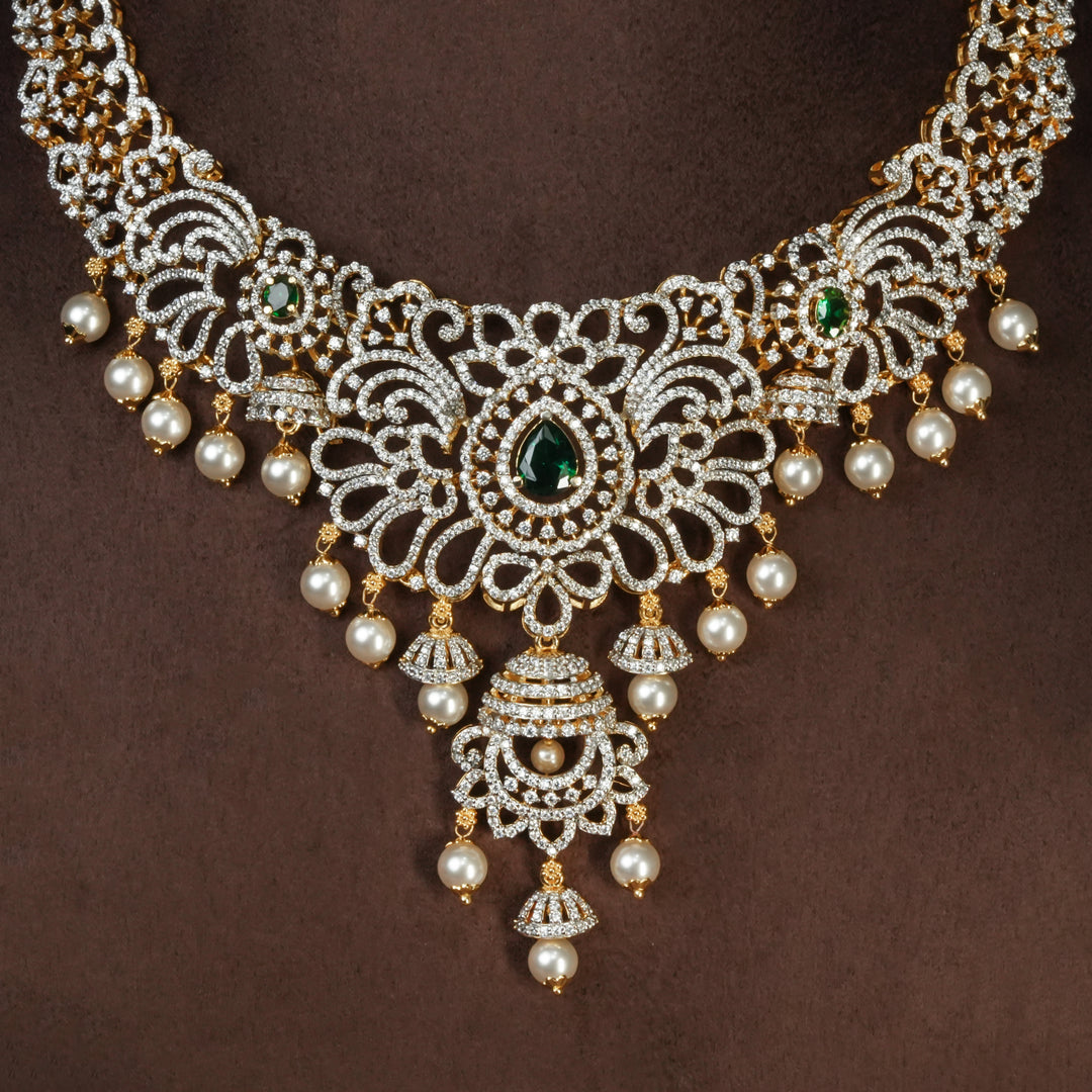 Close-up view of handcrafted designer 92.5 silver cz emerald necklace with premium cz, semi precious emerald and embellishments. Perfect for bridal wear, festive occasions, weddings, and traditional ethnic styling.
Sri fine jewellery, Hyderabad. 
