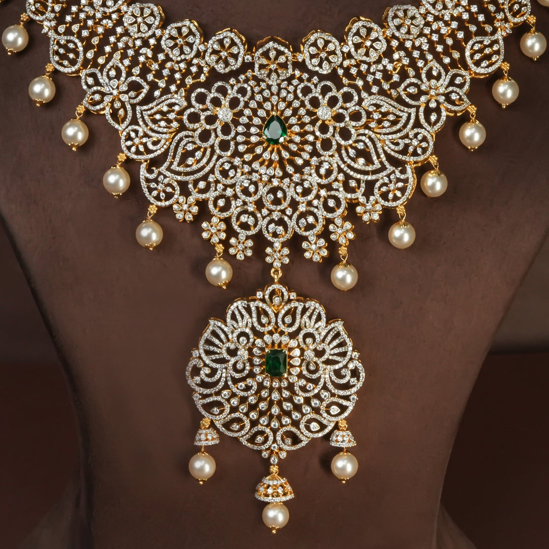 Close-up view of handcrafted designer 92.5 silver cz emerald necklace with premium cz, semi precious emerald embellishments and peacock motifs. Perfect for bridal wear, festive occasions, weddings, and traditional ethnic styling.
Sri fine jewellery, Hyderabad. 