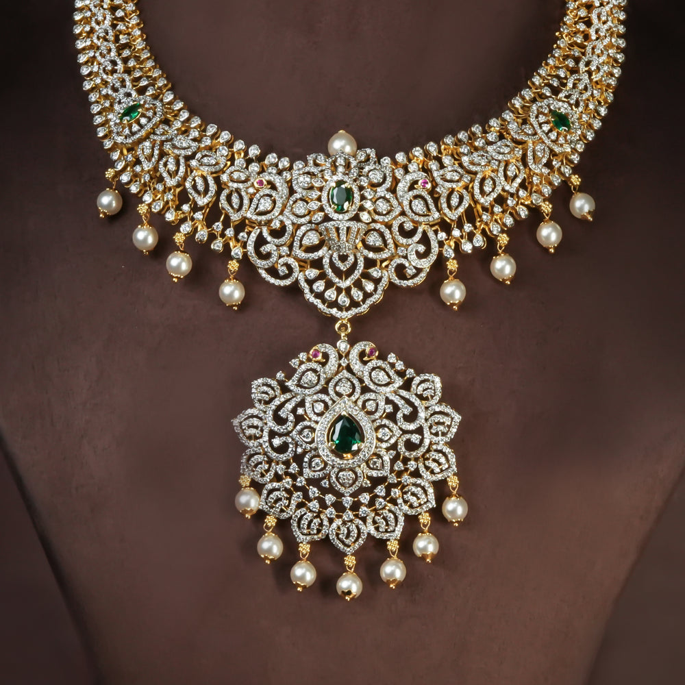 Handcrafted designer 92.5 silver cz emerald necklace with premium cz, semi precious emerald embellishments and peacock motifs. Perfect for bridal wear, festive occasions, weddings, and traditional ethnic styling.
Sri fine jewellery, Hyderabad. 