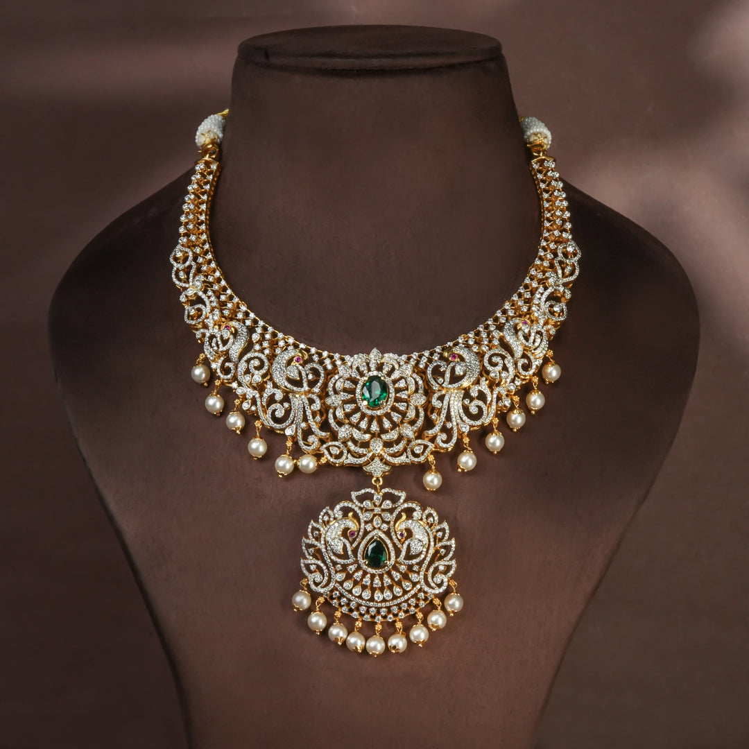 Handcrafted designer 92.5 silver cz emerald necklace with premium cz, semi precious emerald embellishments and peacock motifs. Perfect for bridal wear, festive occasions, weddings, and traditional ethnic styling.
Sri fine jewellery, Hyderabad. 
