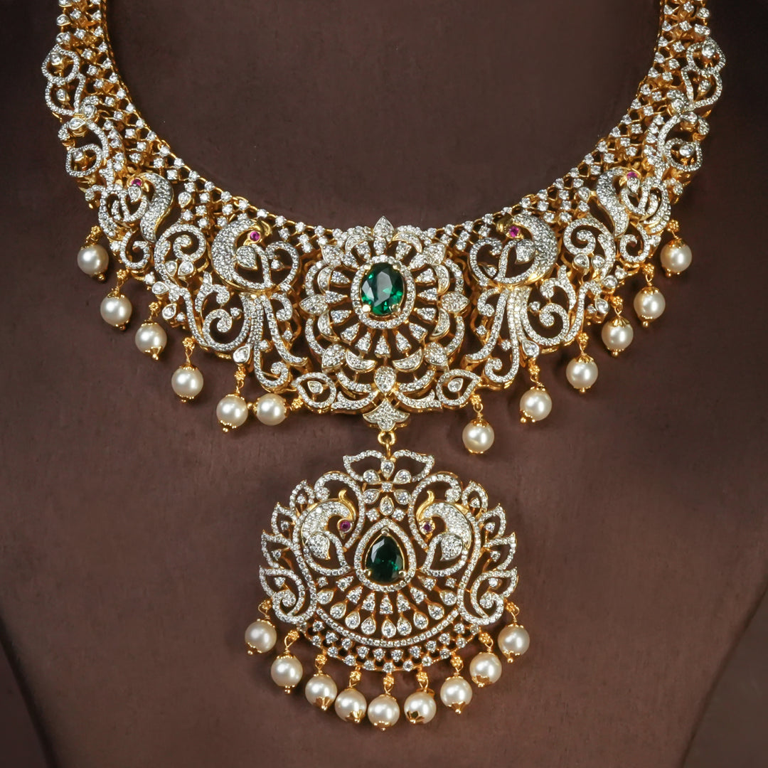 Handcrafted designer 92.5 silver cz emerald necklace with premium cz, semi precious emerald embellishments and peacock motifs. Perfect for bridal wear, festive occasions, weddings, and traditional ethnic styling.
Sri fine jewellery, Hyderabad. 