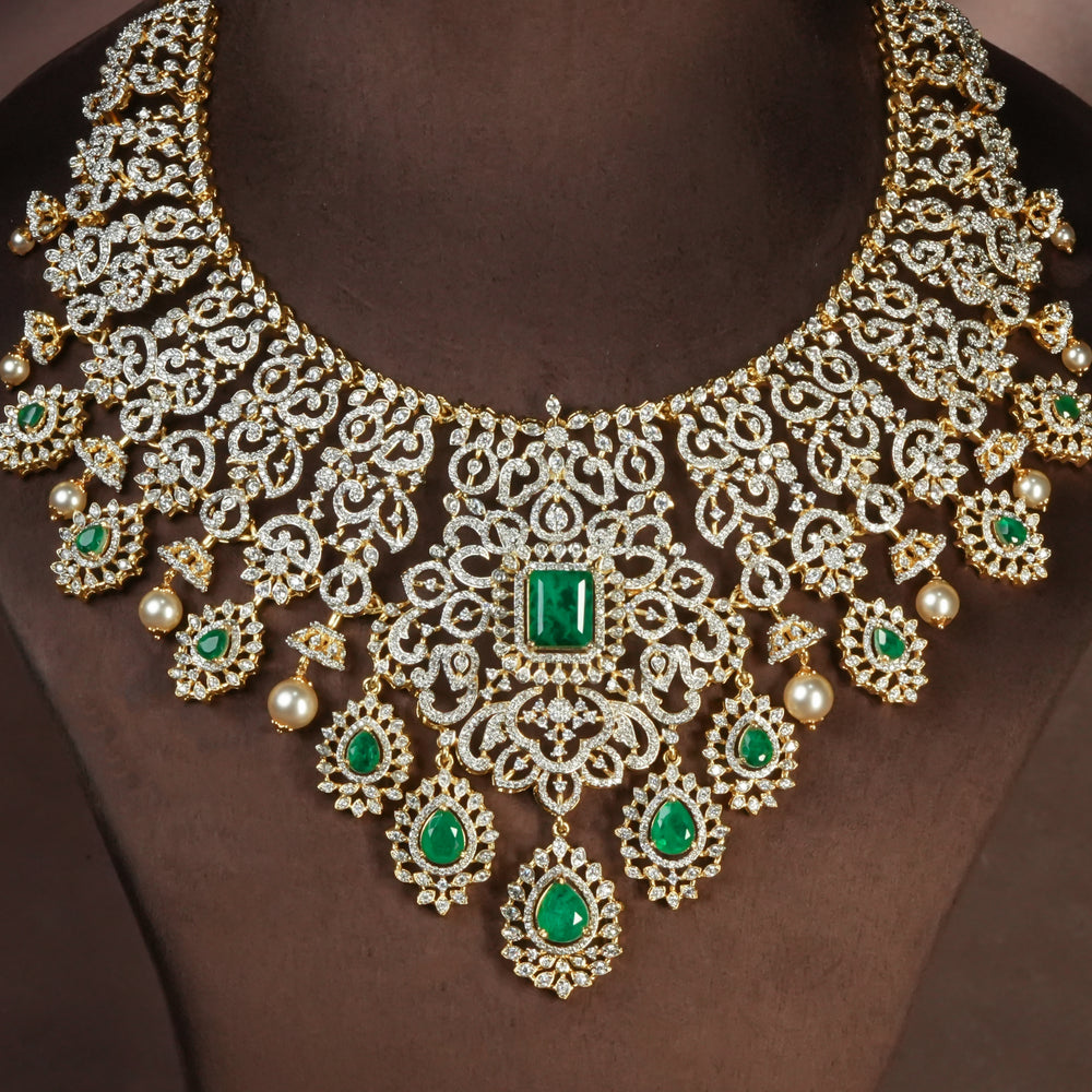 Handcrafted designer 92.5 silver cz emerald necklace with premium cz and semi precious emerald embellishments . Perfect for bridal wear, festive occasions, weddings, and traditional ethnic styling.
Sri fine jewellery, Hyderabad. 