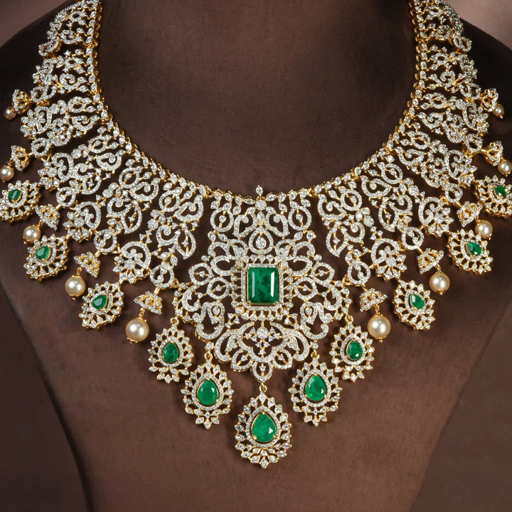 Handcrafted designer 92.5 silver cz emerald necklace with premium cz and semi precious emerald embellishments . Perfect for bridal wear, festive occasions, weddings, and traditional ethnic styling.
Sri fine jewellery, Hyderabad. 