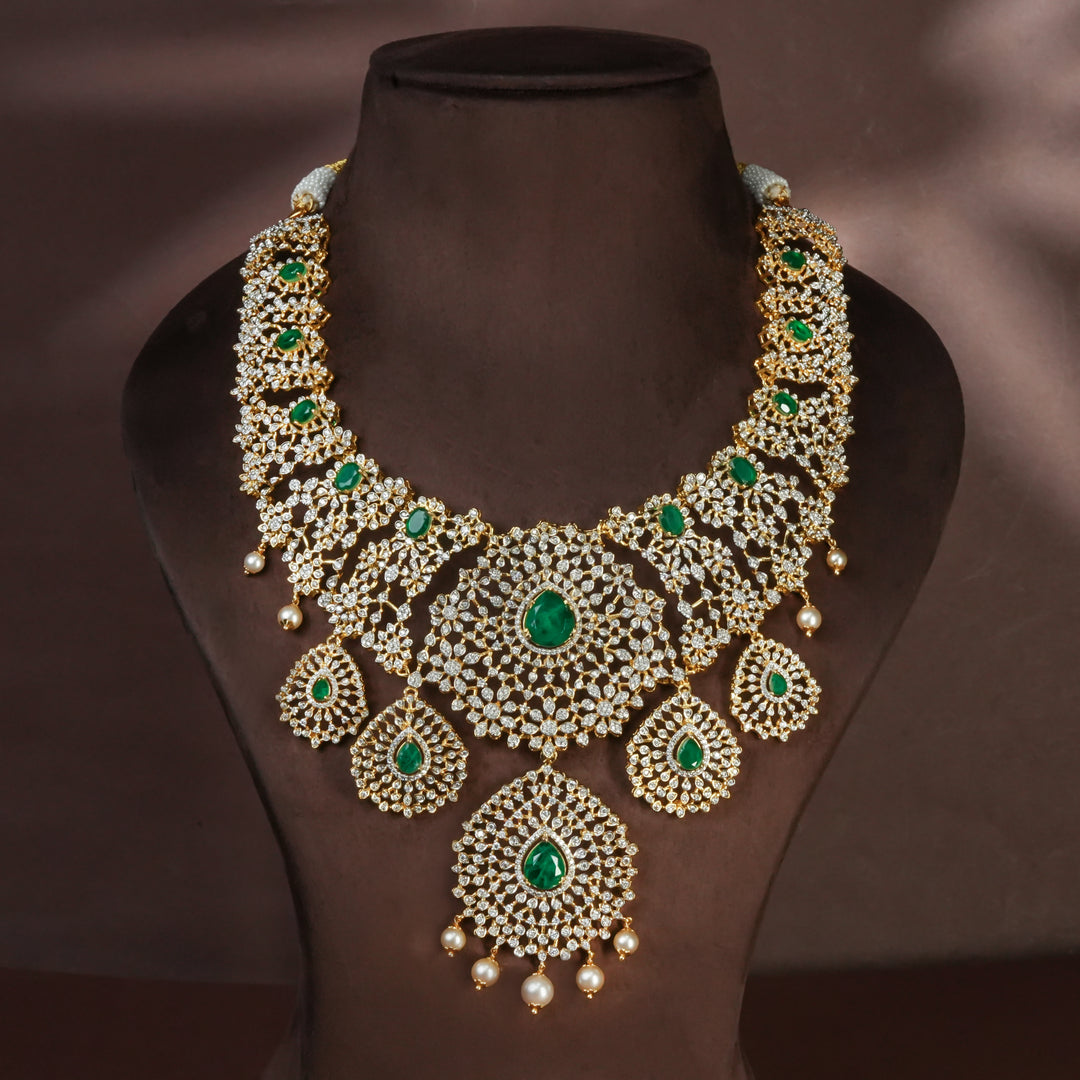 Handcrafted designer 92.5 silver cz emerald necklace with premium cz and semi precious emerald embellishments . Perfect for bridal wear, festive occasions, weddings, and traditional ethnic styling.
Sri fine jewellery, Hyderabad. 