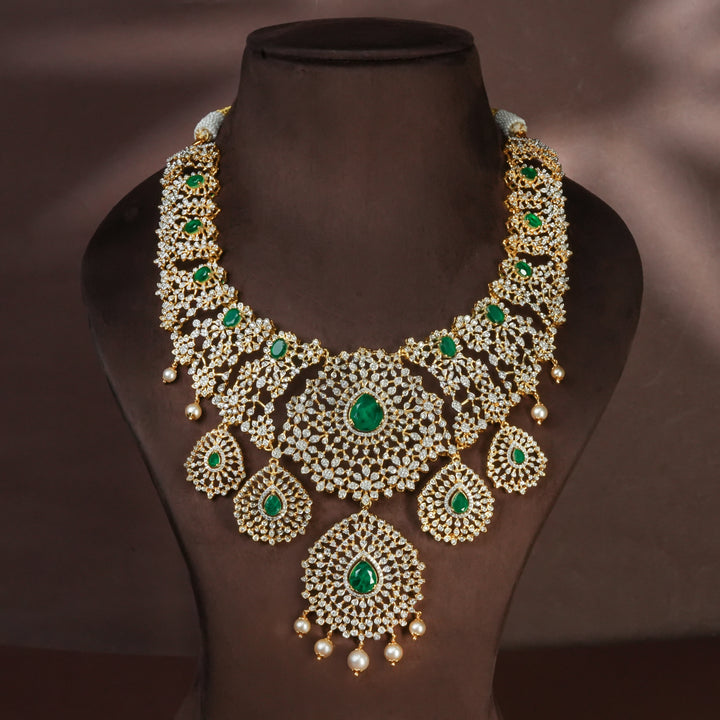 Handcrafted designer 92.5 silver cz emerald necklace with premium cz and semi precious emerald embellishments . Perfect for bridal wear, festive occasions, weddings, and traditional ethnic styling.
Sri fine jewellery, Hyderabad. 