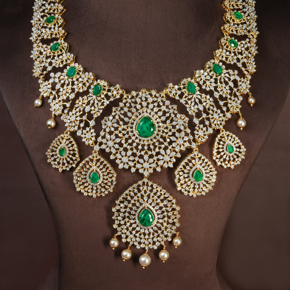 Handcrafted designer 92.5 silver cz emerald necklace with premium cz and semi precious emerald embellishments . Perfect for bridal wear, festive occasions, weddings, and traditional ethnic styling.
Sri fine jewellery, Hyderabad. 