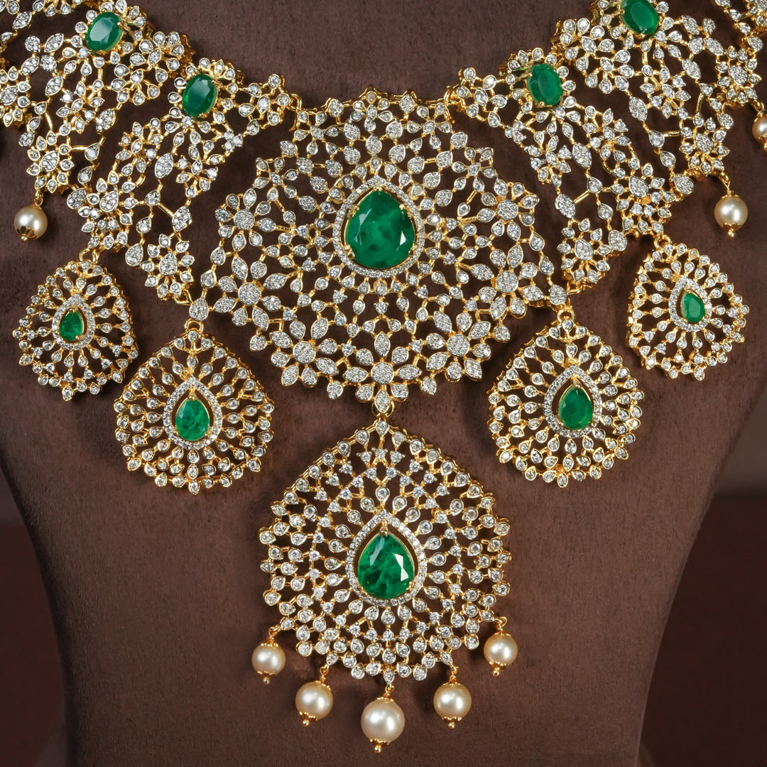 Close-up of handcrafted designer 92.5 silver cz emerald necklace with premium cz and semi precious emerald embellishments . Perfect for bridal wear, festive occasions, weddings, and traditional ethnic styling.
Sri fine jewellery, Hyderabad. 