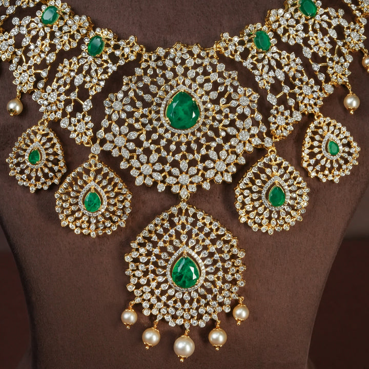 Close-up of handcrafted designer 92.5 silver cz emerald necklace with premium cz and semi precious emerald embellishments . Perfect for bridal wear, festive occasions, weddings, and traditional ethnic styling.
Sri fine jewellery, Hyderabad. 