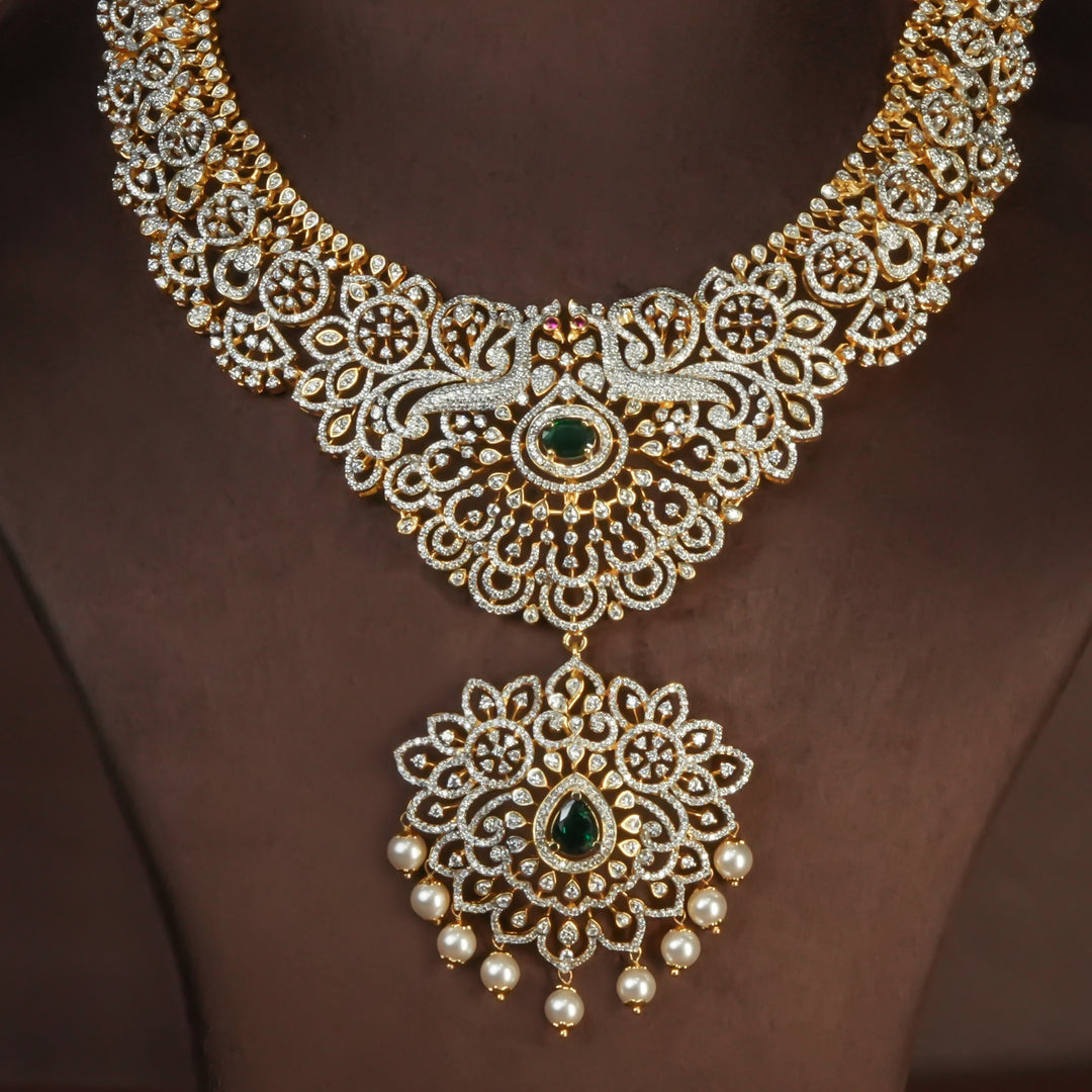 Handcrafted designer 92.5 silver cz emerald necklace with premium cz and semi precious emerald embellishments . Perfect for bridal wear, festive occasions, weddings, and traditional ethnic styling.
Sri fine jewellery, Hyderabad. 