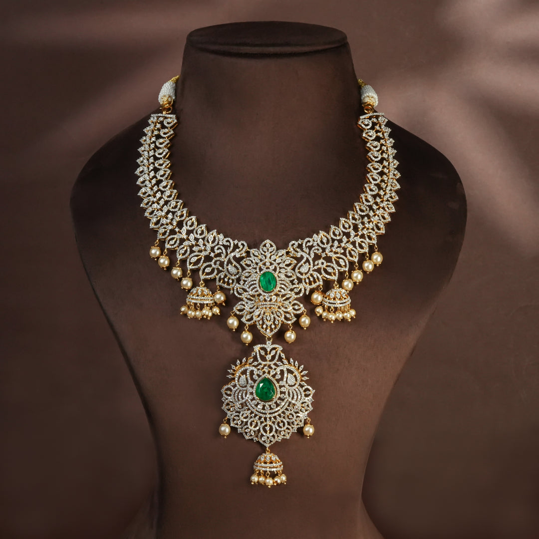 Handcrafted designer 92.5 silver cz emerald necklace with premium cz and semi precious emerald embellishments . Perfect for bridal wear, festive occasions, weddings, and traditional ethnic styling.
Sri fine jewellery, Hyderabad. 